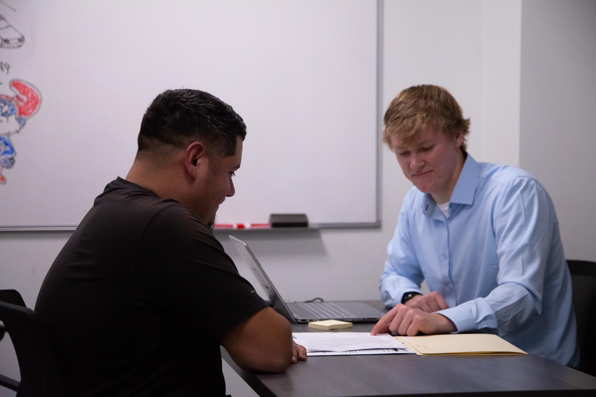 Dalton State business student assists a community member with tax preparation.